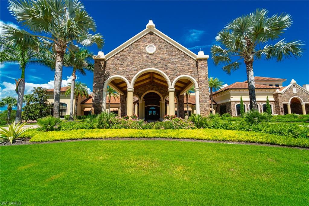 9596 Trevi Court, Unit 5414 Naples, FL 34113 - Photo 31 of 34 a front view of a house with a yard