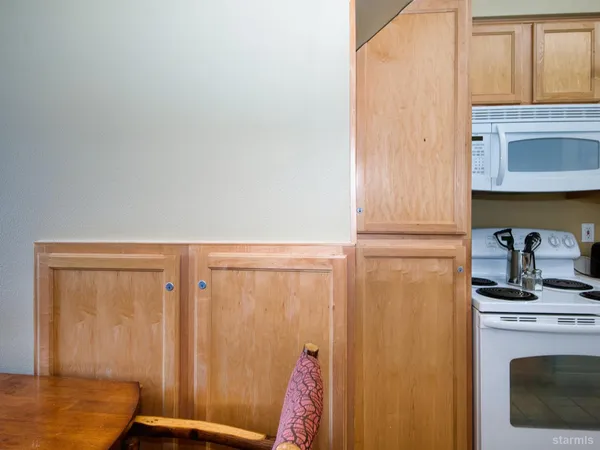a view of a livingroom with furniture and a window