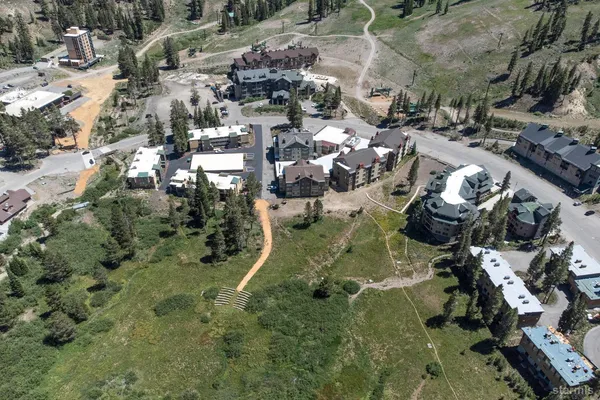 a view of a town with mountains in the background