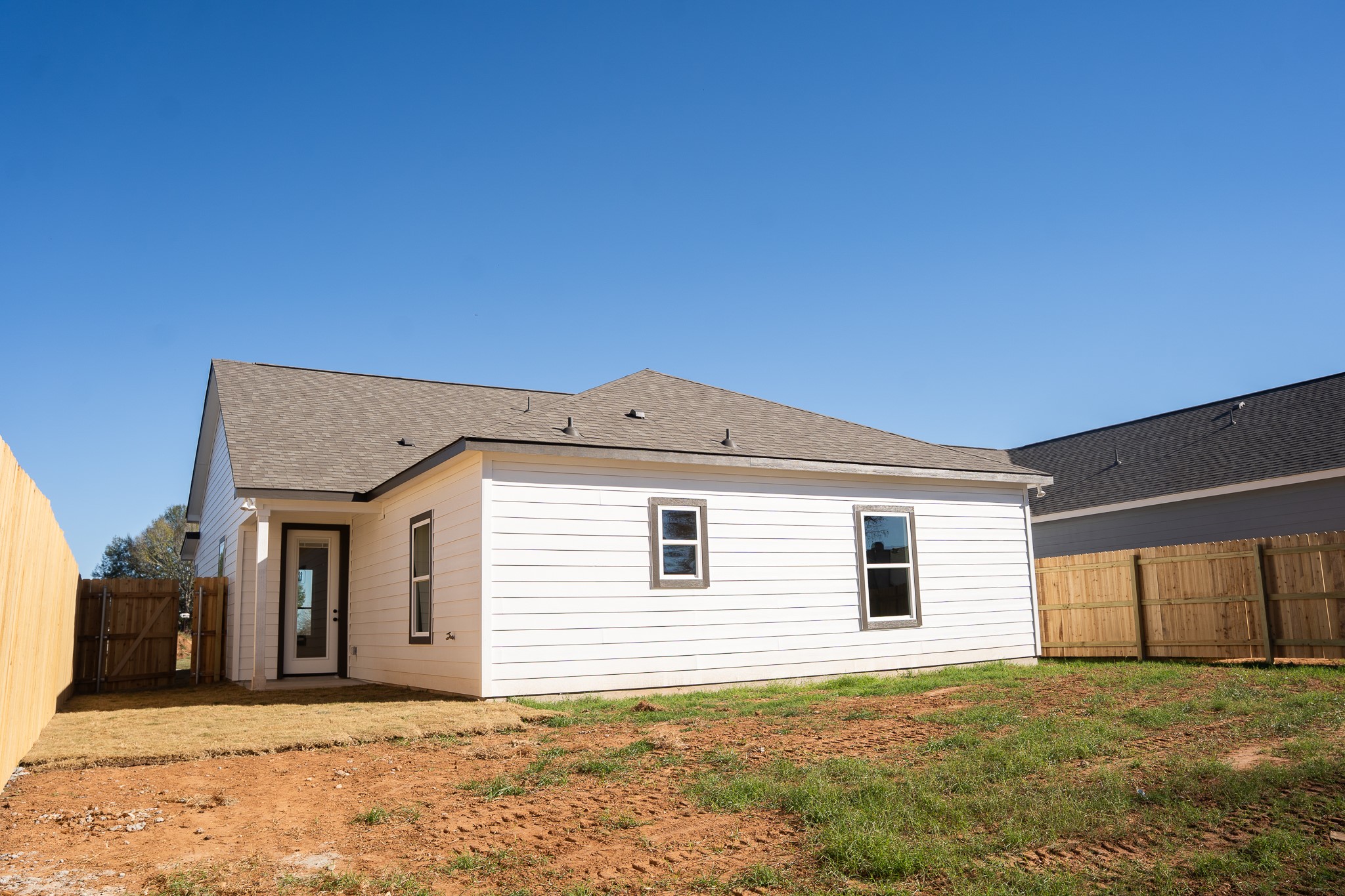 313 String Prairie Way Smithville, TX 78957 - Photo 17 of 18 a view of a house with a backyard