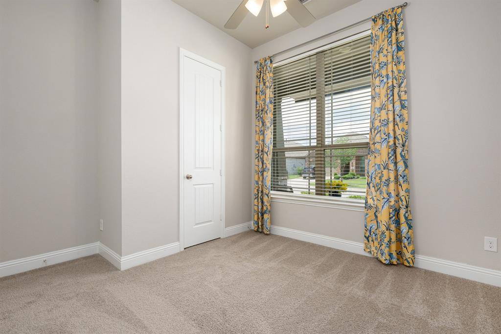 1320 Rosebush Road Aubrey, TX 76227 - Photo 22 of 33 an empty room with window