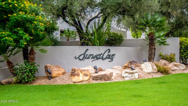 a view of a table and chairs in the garden