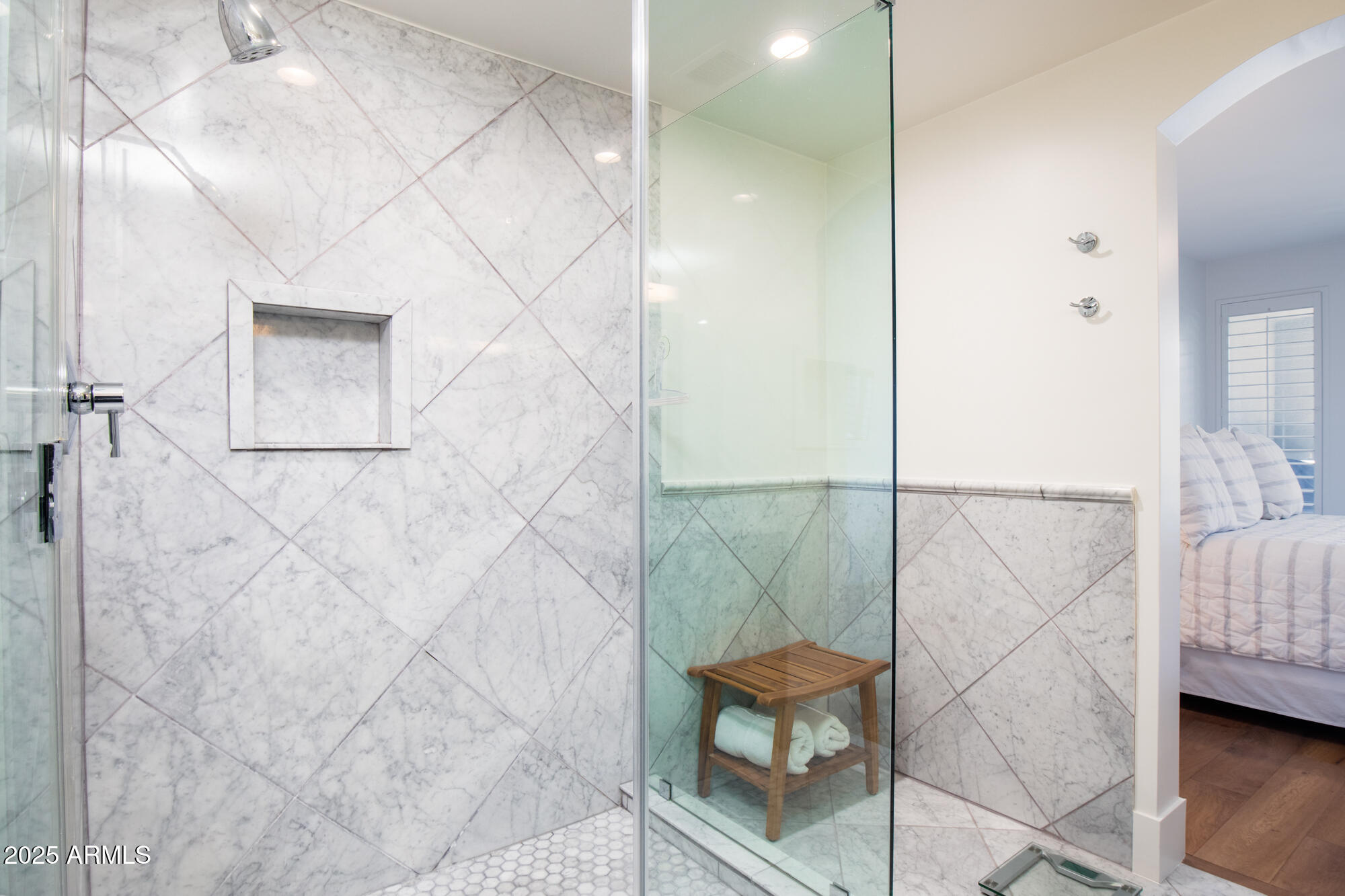 7700 East Gainey Ranch Road, Unit 125 Scottsdale, AZ 85258 - Photo 22 of 46 a bathroom with a bathtub and shower