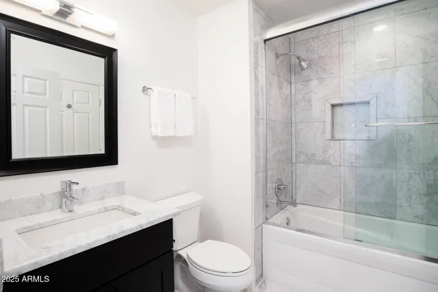 a view of a backyard with a garden and patio