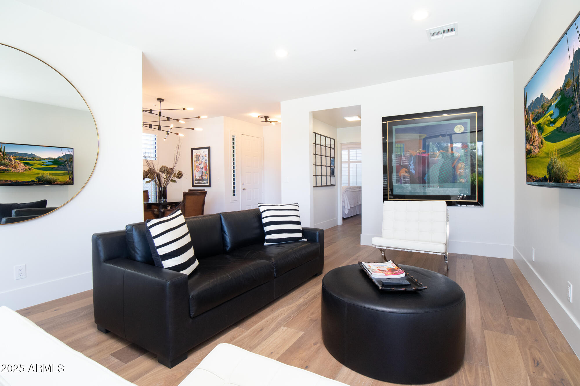 7700 East Gainey Ranch Road, Unit 125 Scottsdale, AZ 85258 - Photo 3 of 46 a living room with furniture and a couch