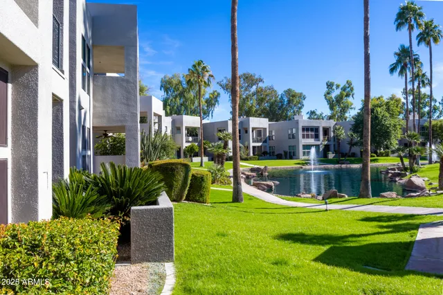 a view of a backyard with swimming pool