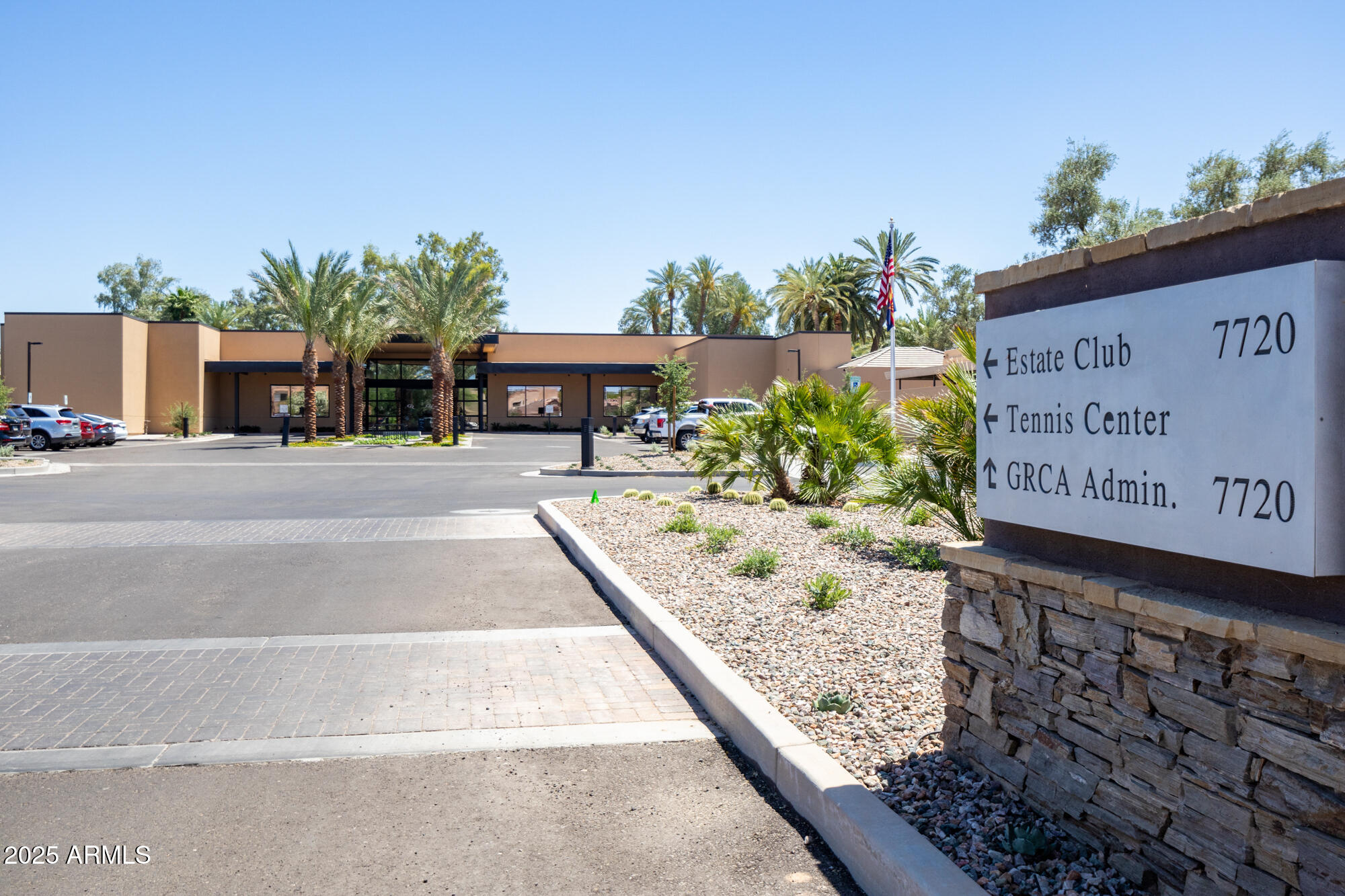 7700 East Gainey Ranch Road, Unit 125 Scottsdale, AZ 85258 - Photo 36 of 46 a view of a sign board with buildings in the background