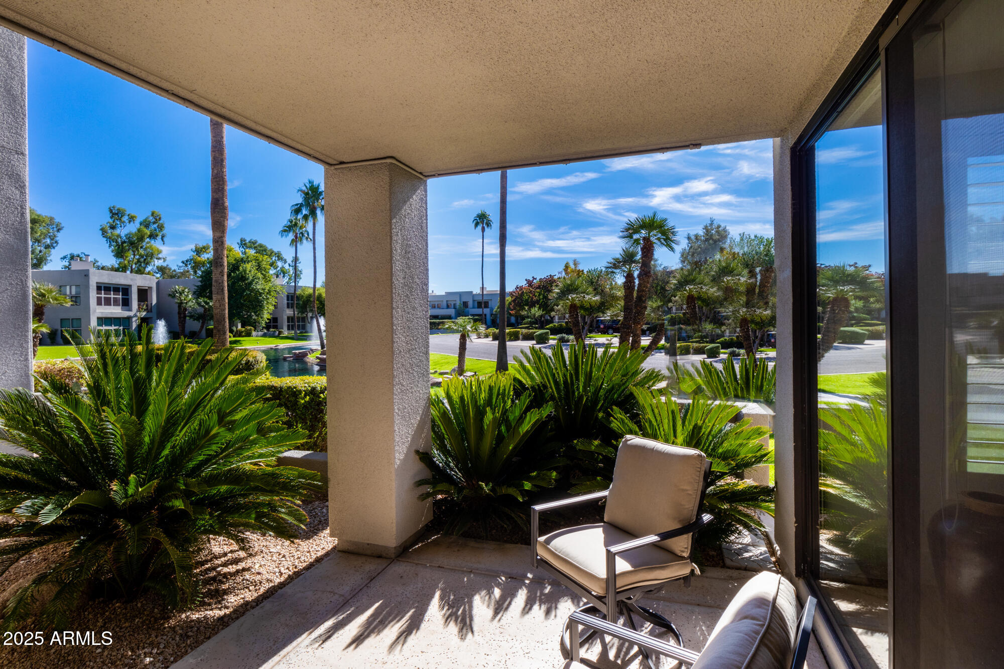 7700 East Gainey Ranch Road, Unit 125 Scottsdale, AZ 85258 - Photo 8 of 46 a view of balcony with furniture and garden