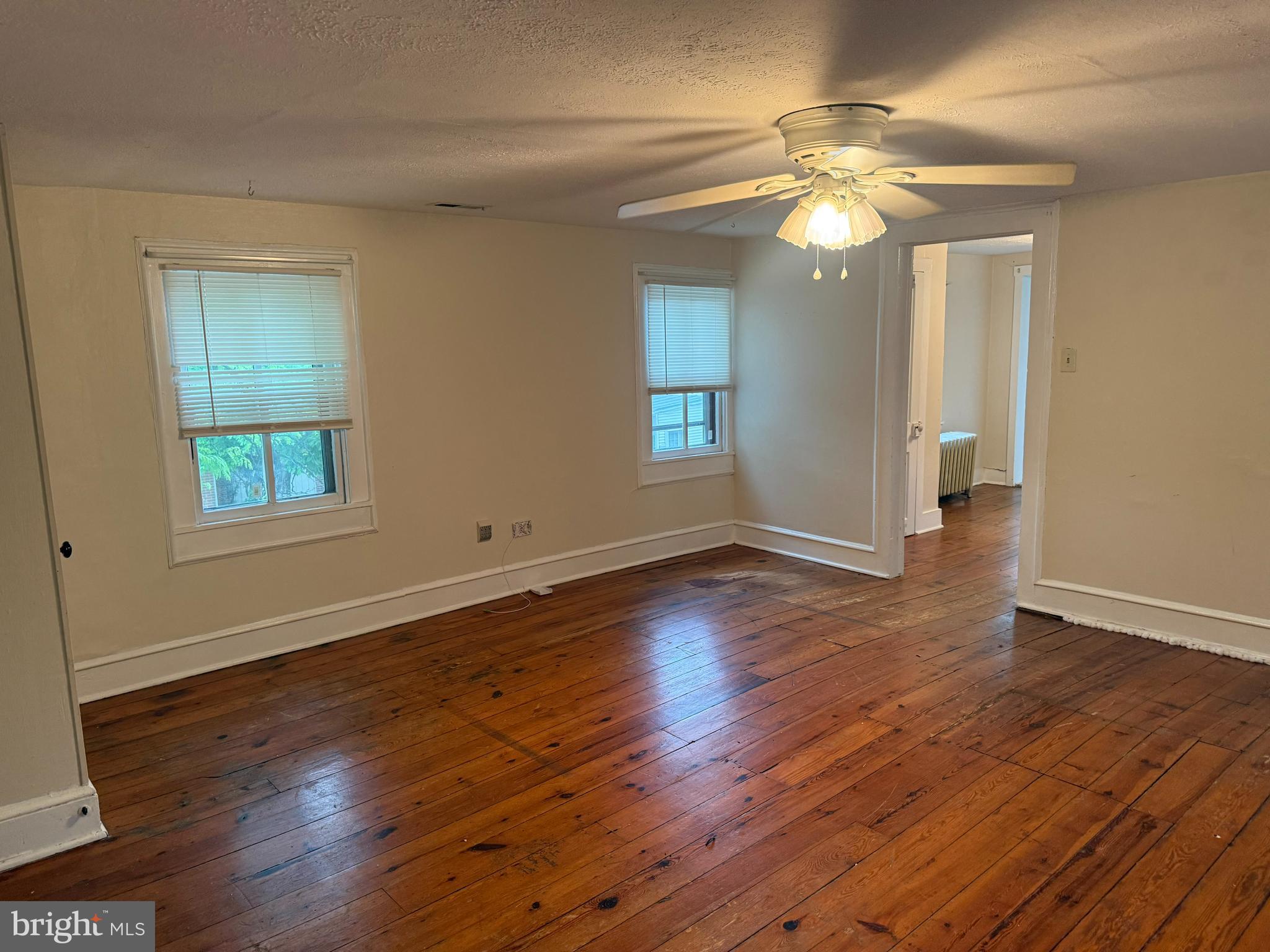 619 South Cameron Street, Unit 2 Winchester, VA 22601 - Photo 2 of 7 a view of empty room with wooden floor and fan