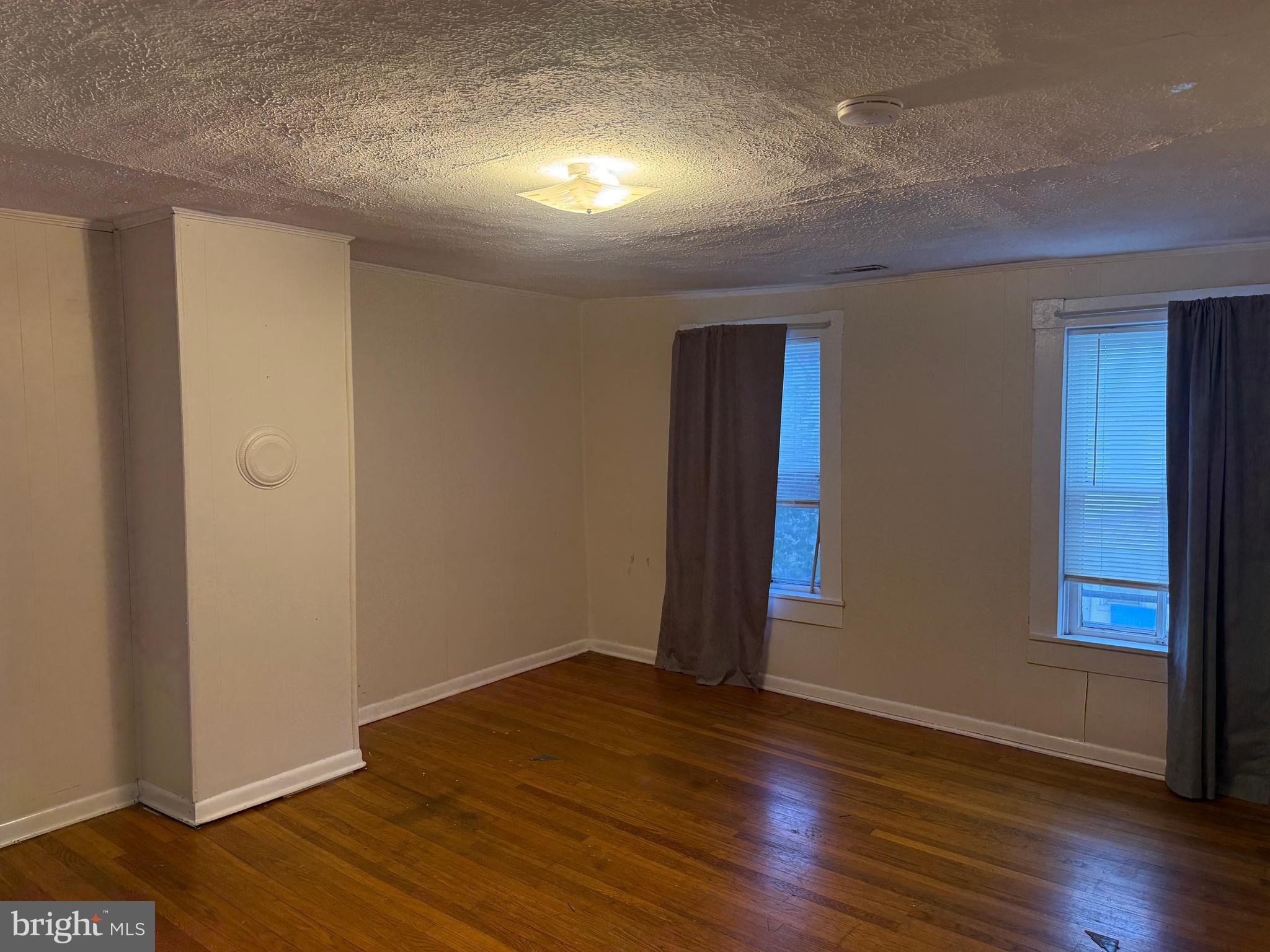 619 South Cameron Street, Unit 2 Winchester, VA 22601 - Photo 5 of 7 a view of an empty room with wooden floor
