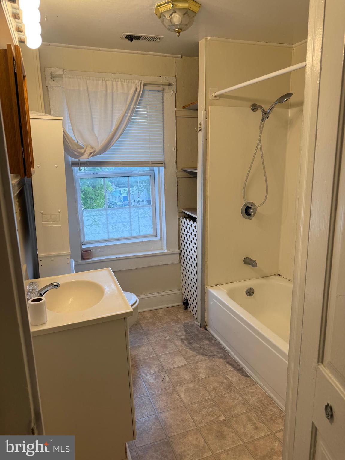 619 South Cameron Street, Unit 2 Winchester, VA 22601 - Photo 7 of 7 a bathroom with a tub a sink and a shower