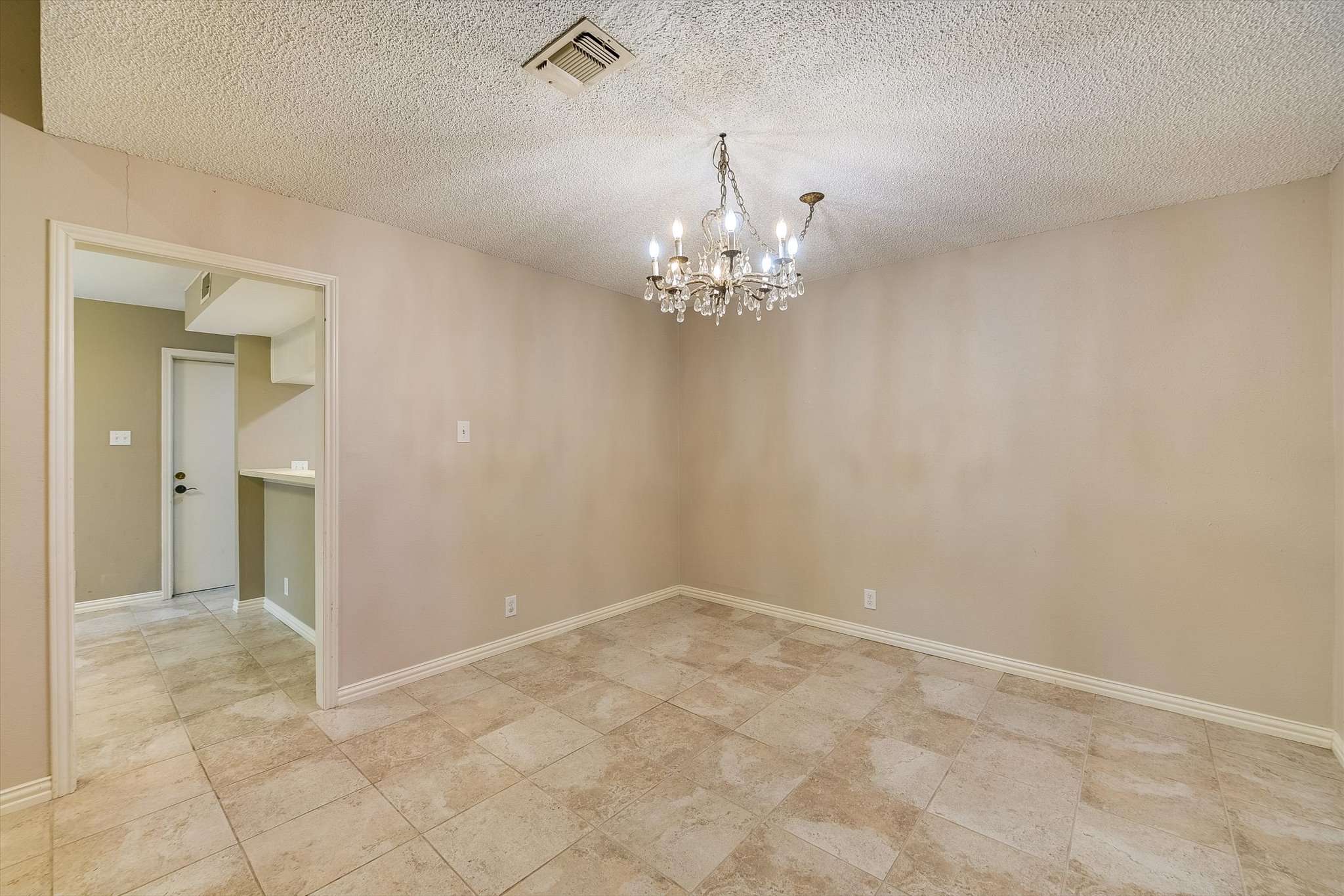 7919 Ridgeline North Austin, TX 78731 - Photo 13 of 23 Oversized formal dining room, hard porcelain tile though out the entire townhouse, no carpet