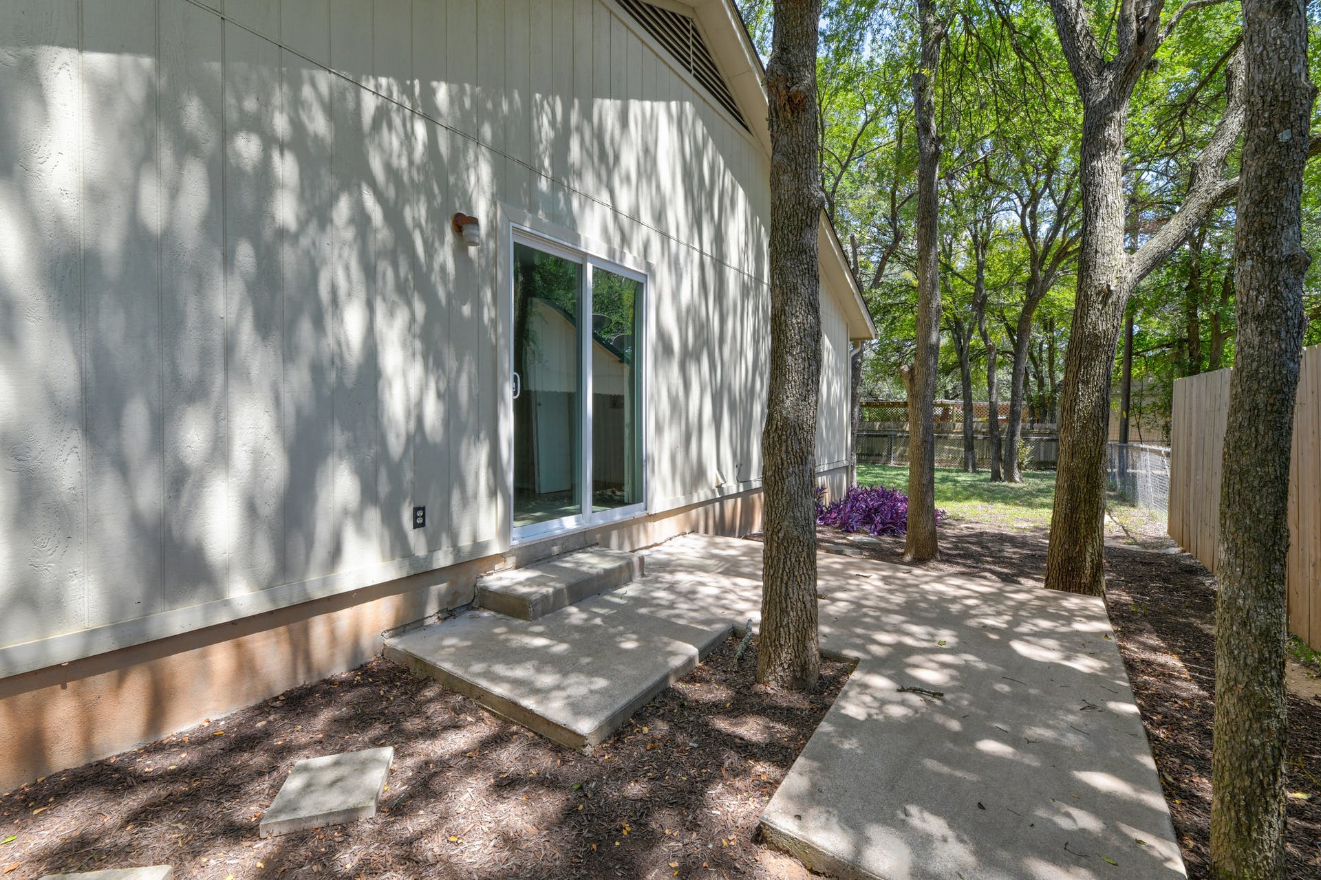 12603 Teague Trail, Unit B Austin, TX 78729 - Photo 12 of 14 a view of a park with large trees
