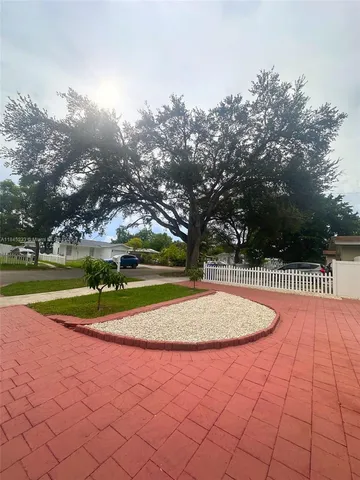 a view of swimming pool and trees in the background