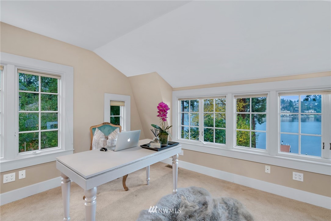3808 Hunts Point Road Hunts Point, WA 98004 - Photo 13 of 24 a living room with furniture and a large window