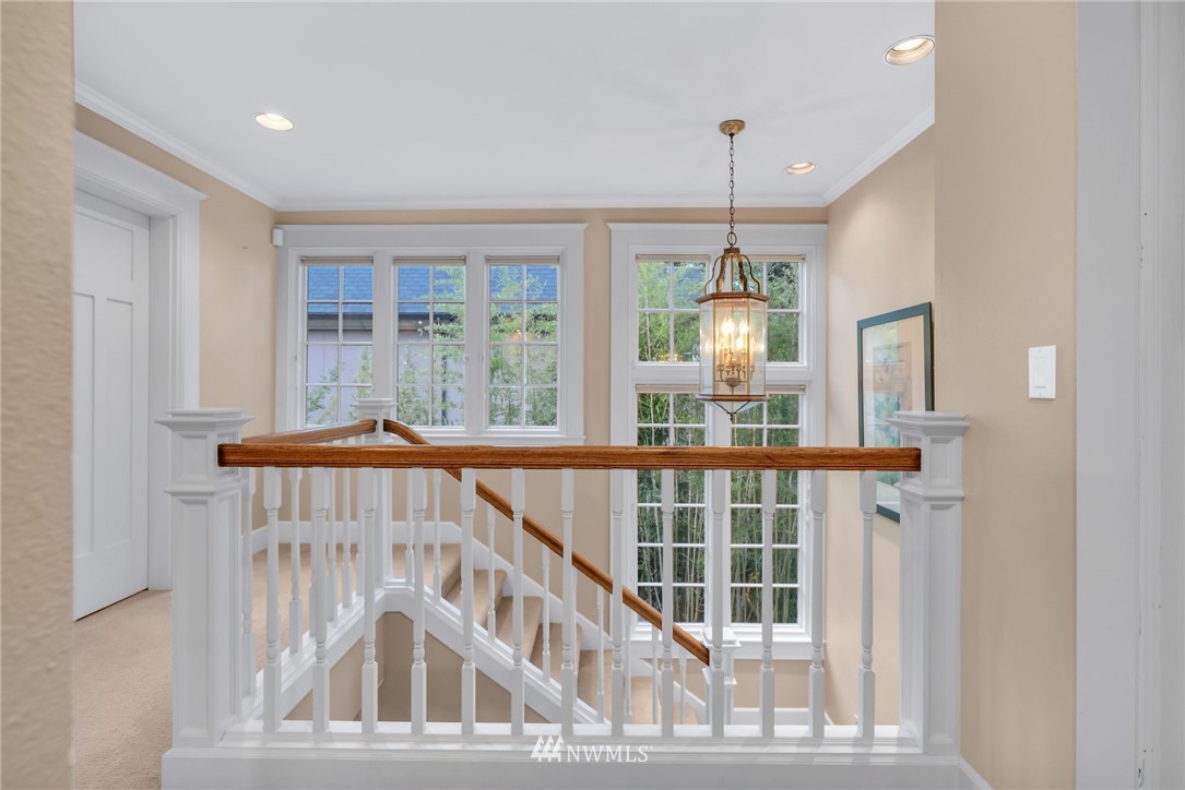 3808 Hunts Point Road Hunts Point, WA 98004 - Photo 18 of 24 a view of staircase with railing and windows