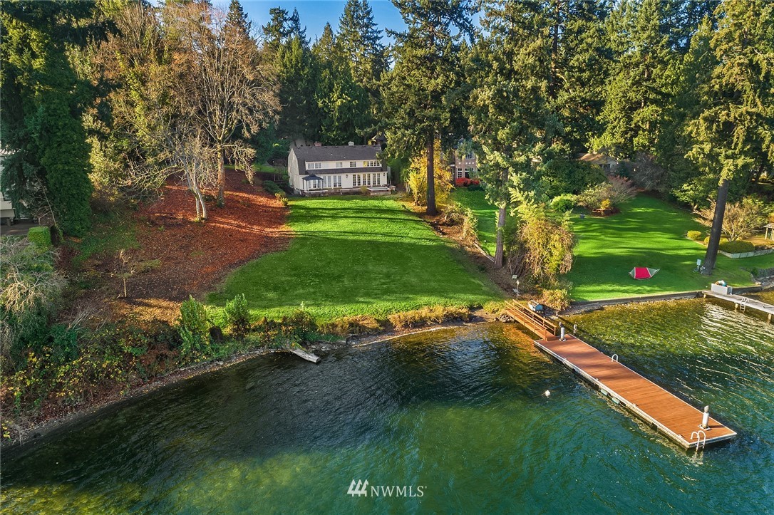 3808 Hunts Point Road Hunts Point, WA 98004 - Photo 23 of 24 a backyard of a house with yard and trampoline
