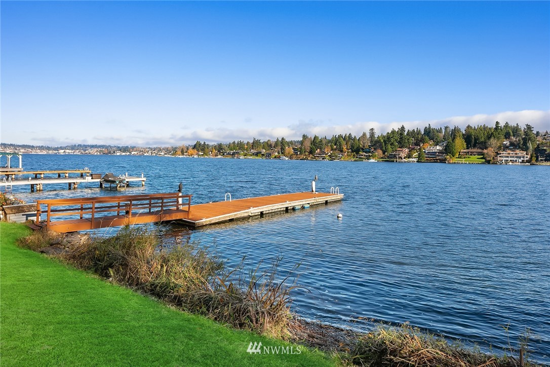 3808 Hunts Point Road Hunts Point, WA 98004 - Photo 4 of 24 a view of a lake with houses in the back