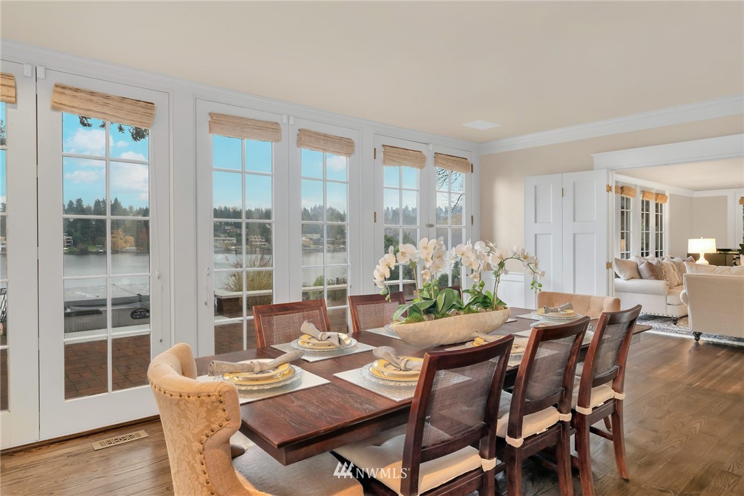 3808 Hunts Point Road Hunts Point, WA 98004 - Photo 9 of 24 a view of a dining room with furniture window and wooden floor