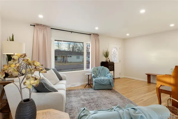 a living room with furniture and a large window