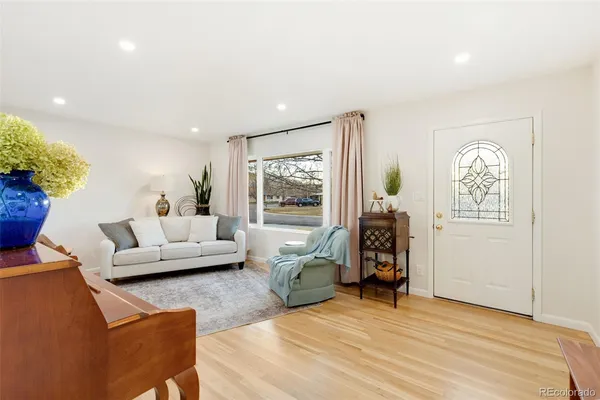 a living room with furniture and a window
