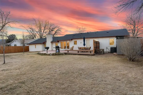 a view of a house with a back yard
