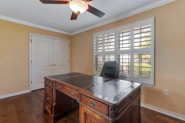 a living room with hard wood floors