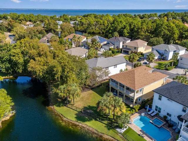 an aerial view of a house with yard swimming pool and outdoor seating