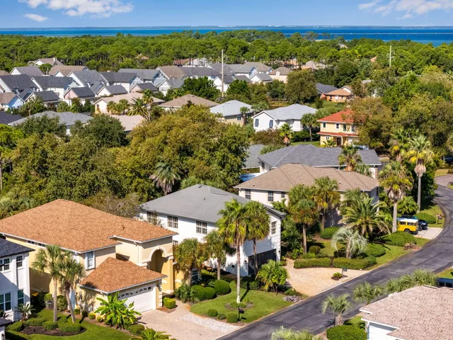 an aerial view of residential houses and outdoor space