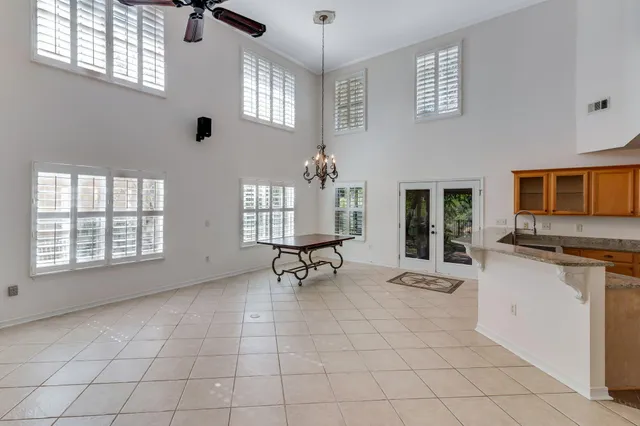 a living room with patio furniture and a window