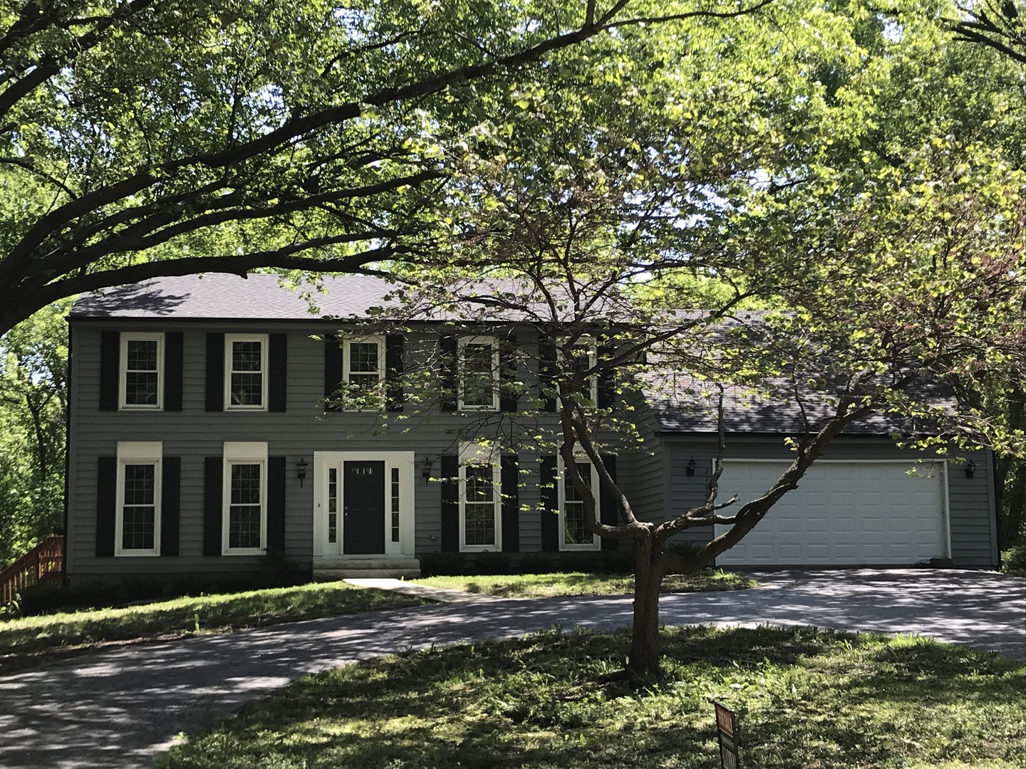 2704 South Red Barn Road Crystal Lake, IL 60012 - Photo 1 of 17 a front view of a house with a yard