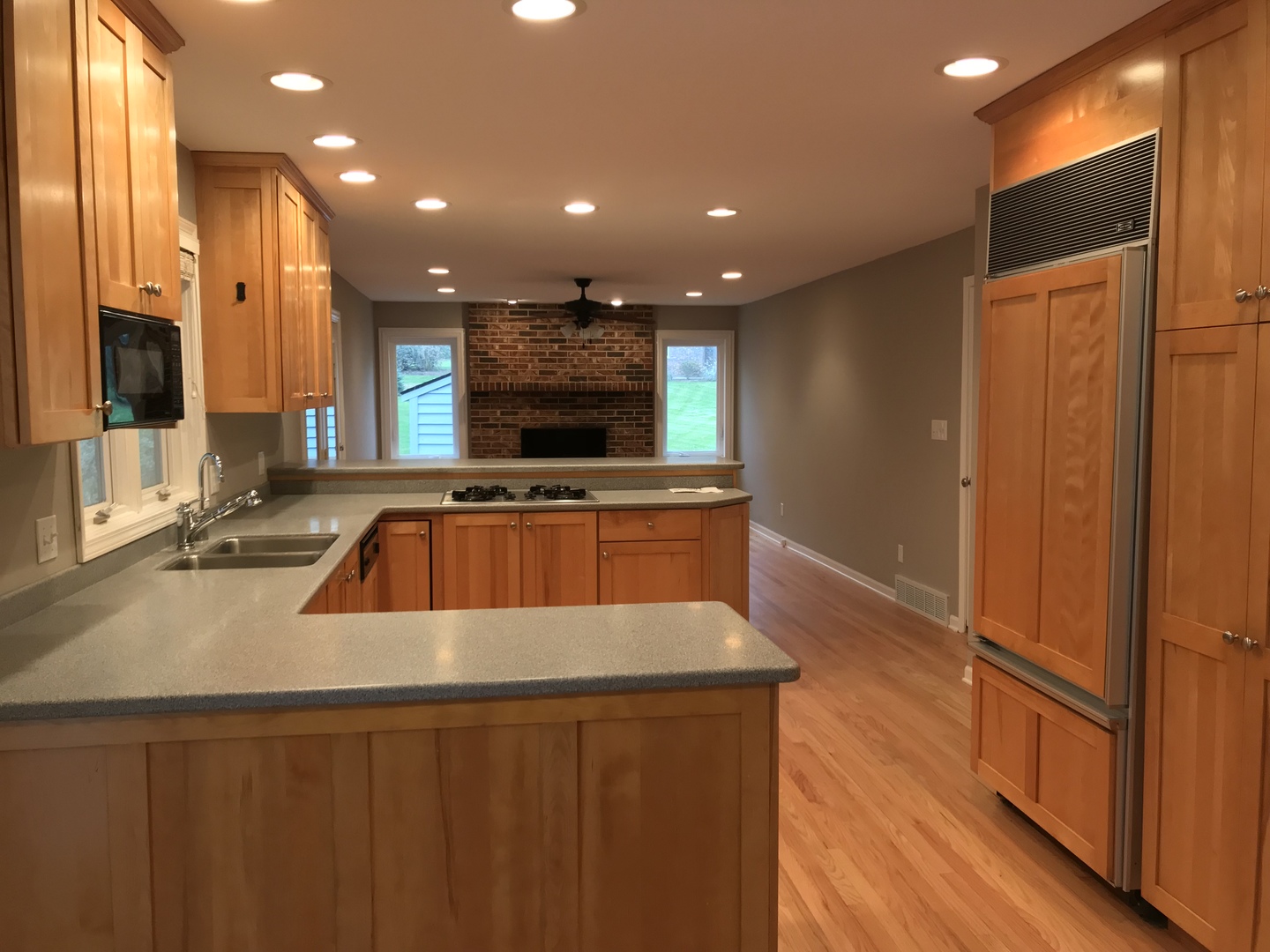 2704 South Red Barn Road Crystal Lake, IL 60012 - Photo 5 of 17 a kitchen with stainless steel appliances a sink a counter top space cabinets and a wooden floor