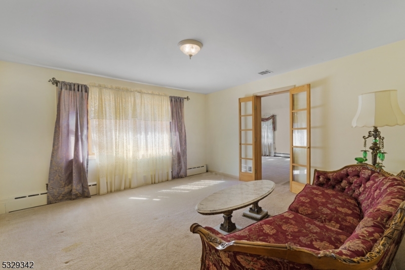 312 Naughright Road Long Valley, NJ 07853 - Photo 12 of 32 a living room with furniture and a window