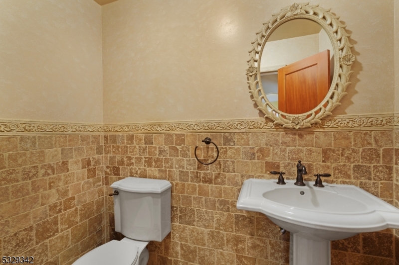 312 Naughright Road Long Valley, NJ 07853 - Photo 13 of 32 a bathroom with a toilet sink and mirror