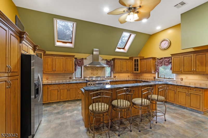 312 Naughright Road Long Valley, NJ 07853 - Photo 5 of 32 a kitchen with stainless steel appliances granite countertop a stove refrigerator and cabinets
