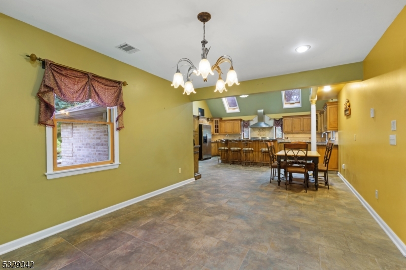 312 Naughright Road Long Valley, NJ 07853 - Photo 8 of 32 a view of a dining room with furniture and chandelier