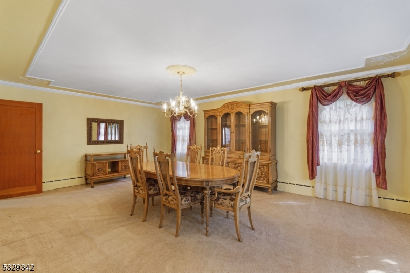 312 Naughright Road Long Valley, NJ 07853 - Photo 10 of 32 a view of a dining room with furniture and a chandelier
