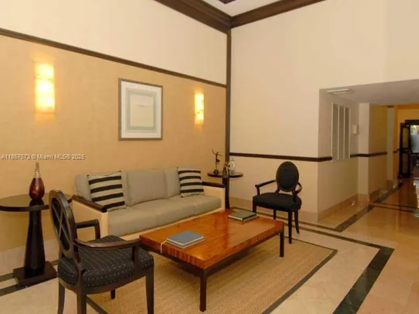 a bedroom with furniture and a rug