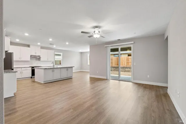 a view of kitchen with cabinets and wooden floor