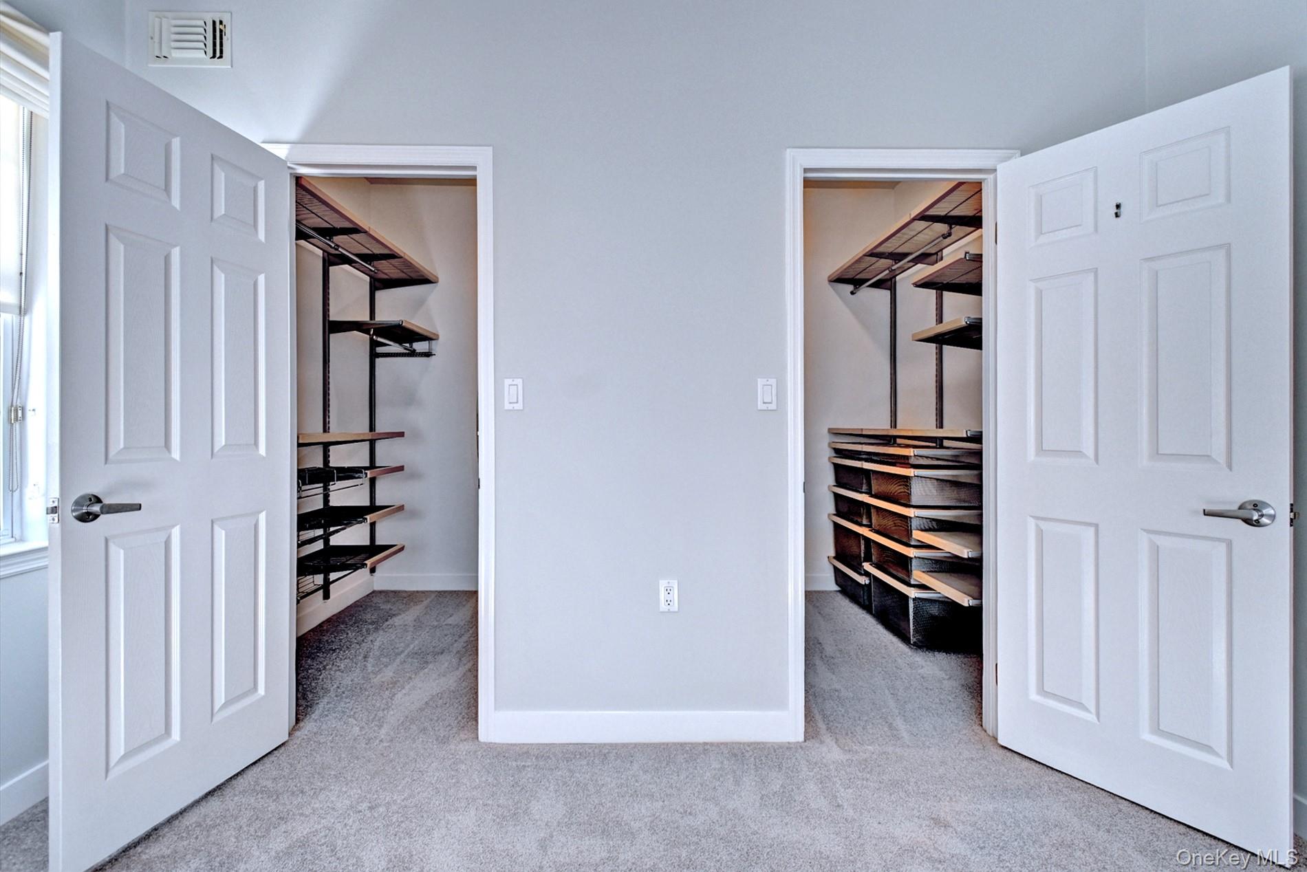 530 Leisure Drive Ridge, NY 11961 - Photo 16 of 26 His and Her Walk in Closets with Organizers