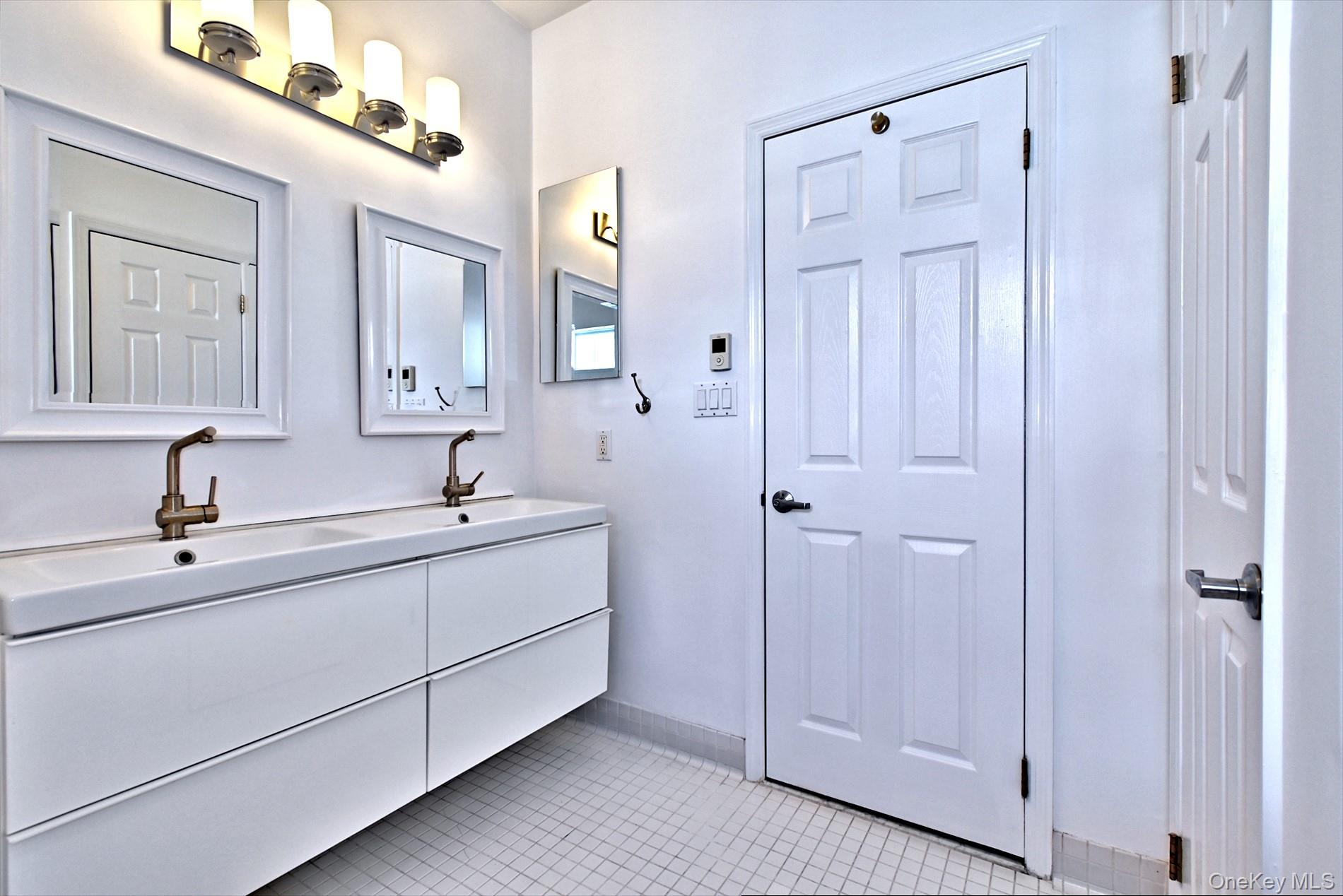 530 Leisure Drive Ridge, NY 11961 - Photo 19 of 26 His and Hers Sinks in the Modern Vanity