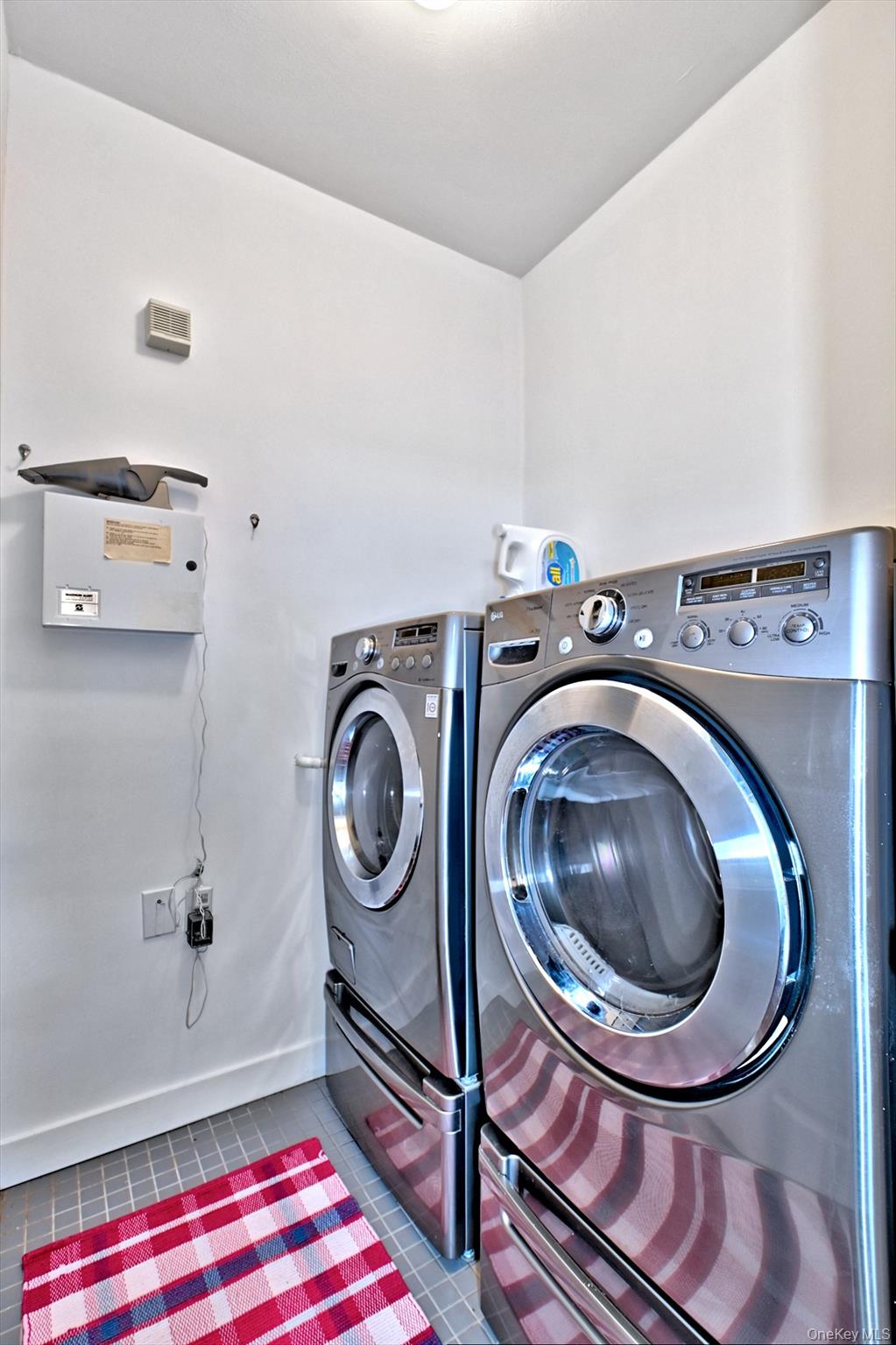 530 Leisure Drive Ridge, NY 11961 - Photo 24 of 26 Newer Stainless Steel Washer and Dryer in the Laundry Room