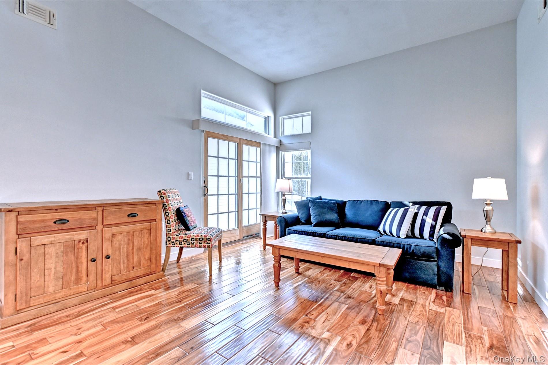 530 Leisure Drive Ridge, NY 11961 - Photo 4 of 26 High Ceilings with Transom Windows and Slider to the Patio