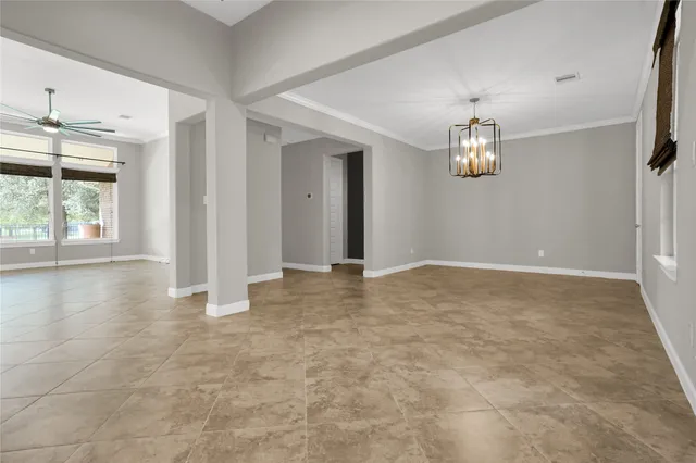 a kitchen with granite countertop stainless steel appliances and wooden cabinets