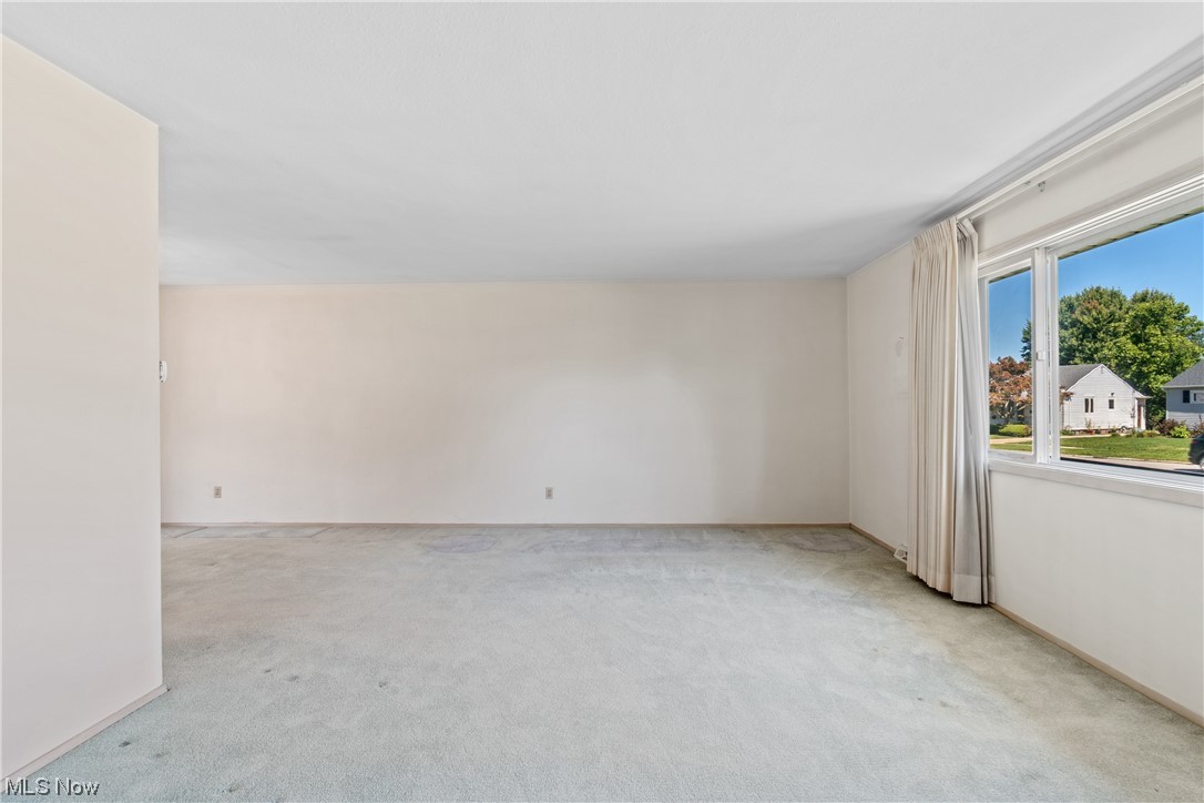 1722 Chelmsford Road Cleveland, OH 44124 - Photo 2 of 34 Unfurnished room featuring light carpet