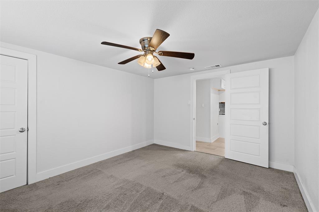 3514 Larry Street Rowlett, TX 75088 - Photo 16 of 27 a view of a ceiling fan in a room
