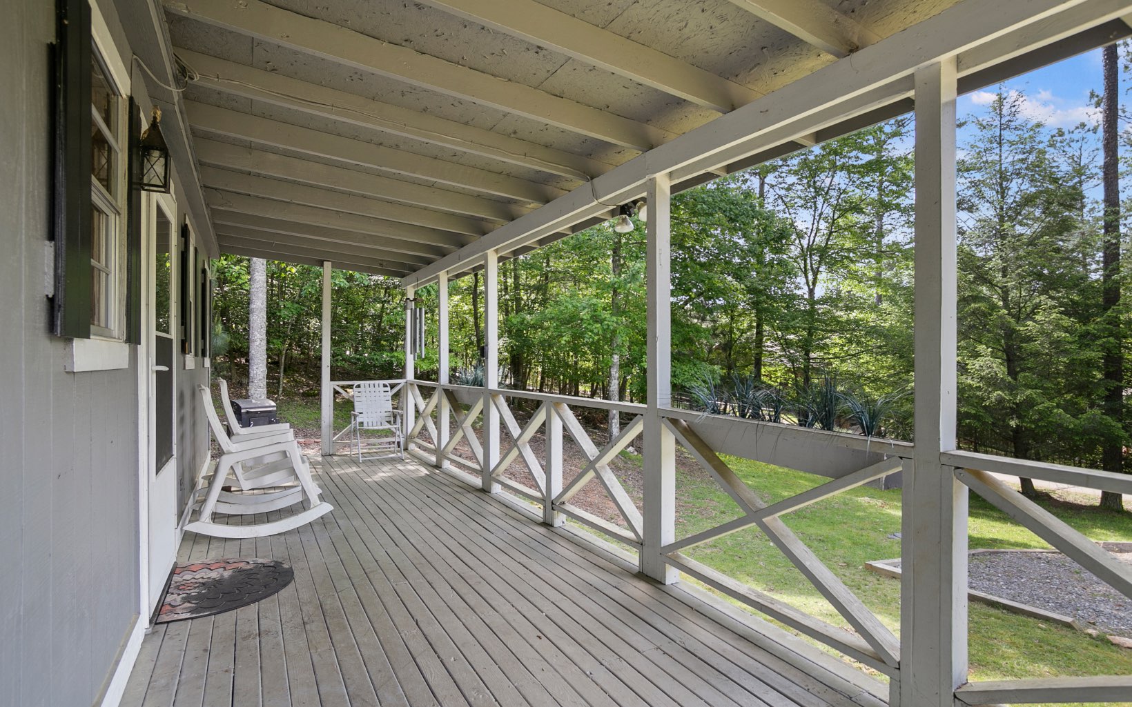 12 Rose Court Ellijay, GA 30540 - Photo 12 of 34 a view of a balcony with chairs and wooden floor