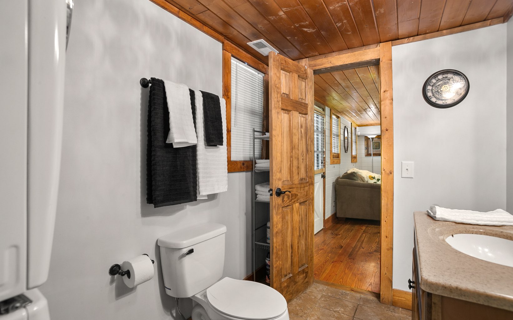 12 Rose Court Ellijay, GA 30540 - Photo 20 of 34 a bathroom with a toilet sink and shower curtain