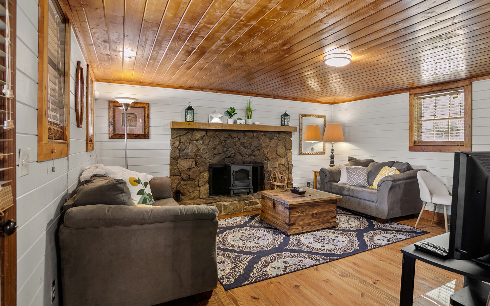 12 Rose Court Ellijay, GA 30540 - Photo 3 of 34 a living room with furniture and a fireplace