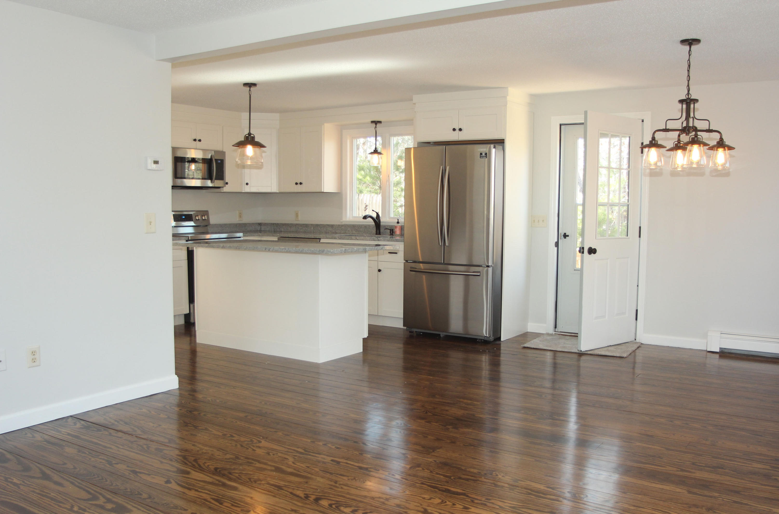 725 School House Road Eastham, MA 02642 - Photo 5 of 35 Living Room to Kitchen